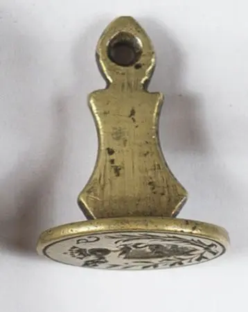 Tłok pieczętny z herbem Łabędź