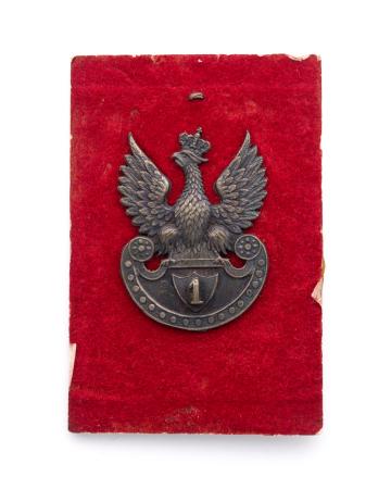 Orzeł wz. 17 produkcji firmy Grynszpan w Warszawie, cyfra pułkowa 1 na tarczy amazonek. 1916r.
