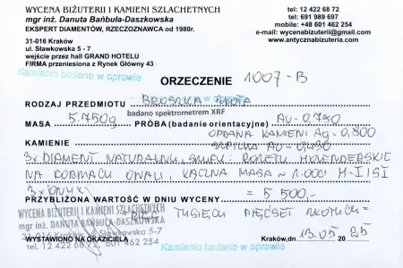Broszka złota z diamentami i onyksami