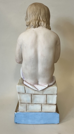 Dziecko piszące na tabliczce 